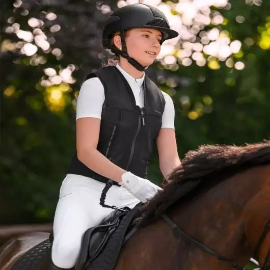 Rider wearing an equestrian airbag vest for horse riding safety