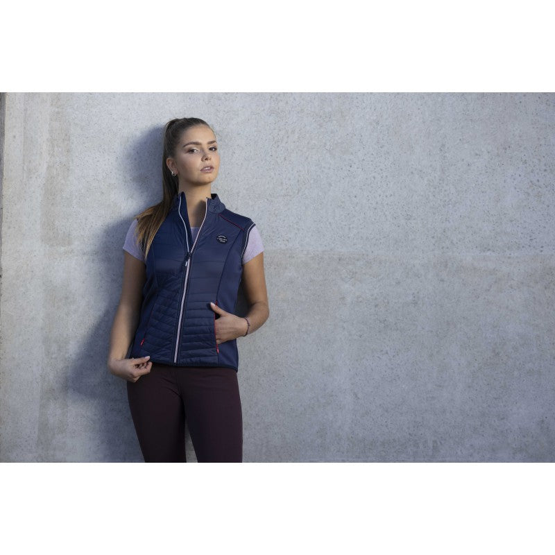 Woman wearing Luna navy hybrid gilet at the stables – equestrian lifestyle vest by Equitheme at Ekkivibes
